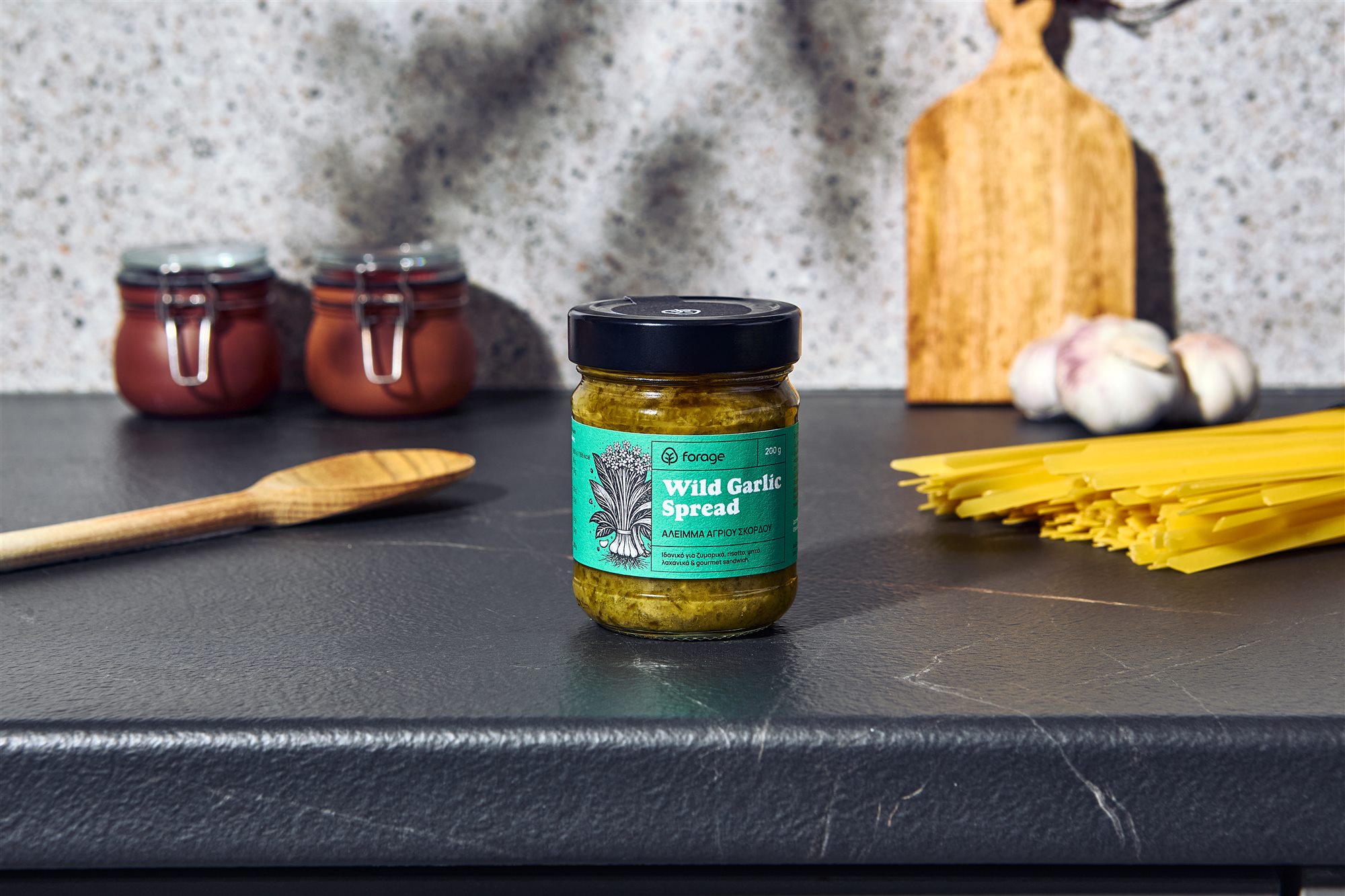 Forage wild garlic spread jar on dark stone surface