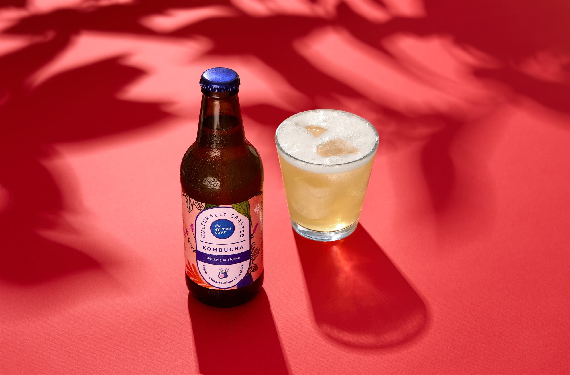 The Greek Gut Wild Fig and Thyme kombucha on red colour background