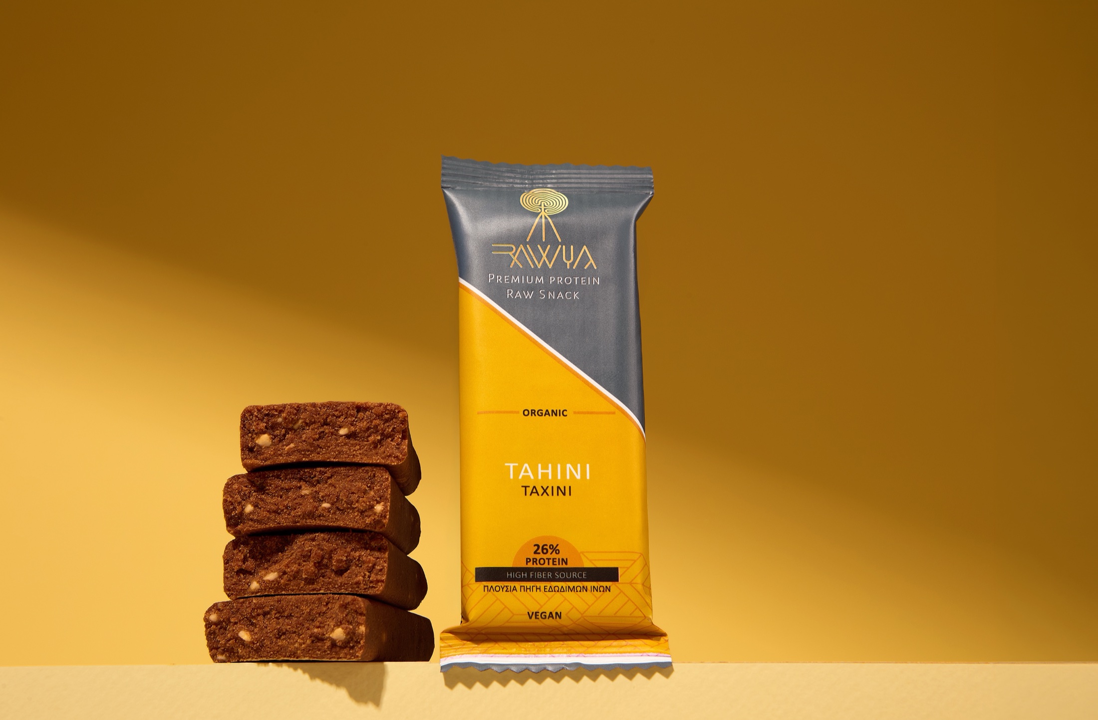 Rawyal tahini and raw snack product hero with warm food styling
